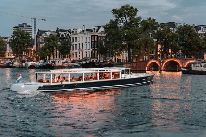 Amsterdam Small-Group Evening Canal Cruise Including Wine, Craft Beer, Cheese - Why Amsterdam looks different from the water at night