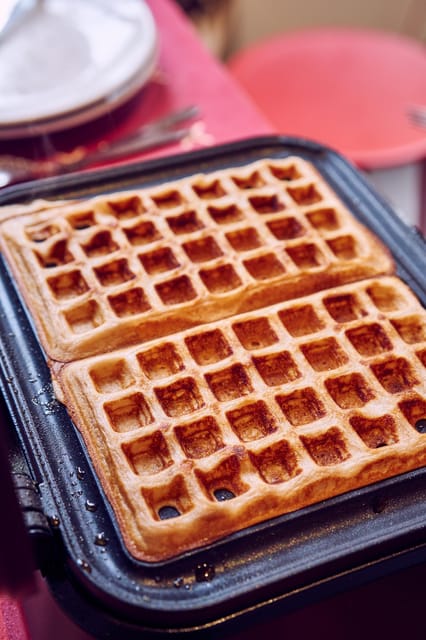 Brussels: Belgian Waffle Making Workshop with Beer Tasting - Cooking Brussels waffles until you are full