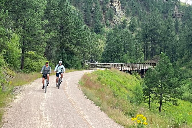 Full-Day Private Bike Tour of Mickelson Trail and Brewery - Getting fitted for the supplied gravel bike