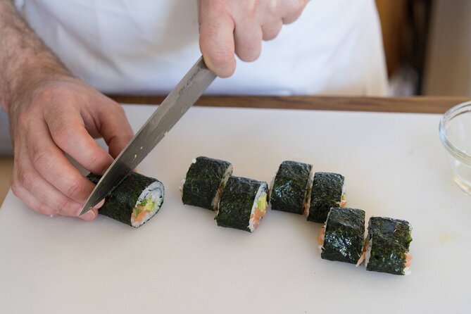 Sushi Making Cooking Class at a Local Brewery in Charlotte - Rolling the spicy tuna creation